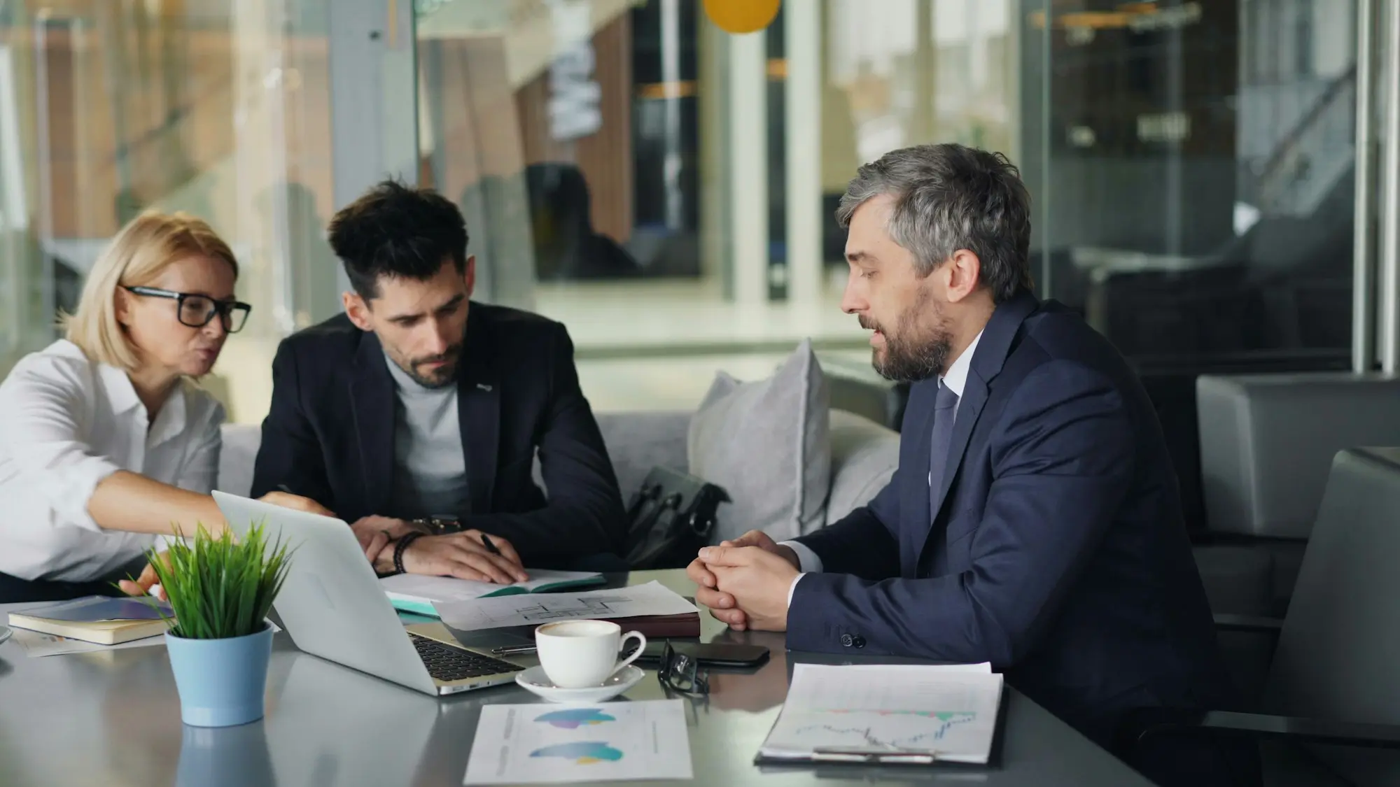 Business owner meeting advisers around a table