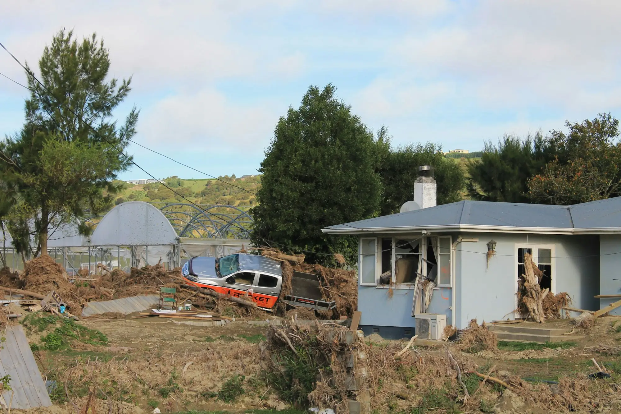New house under construction with a car out front